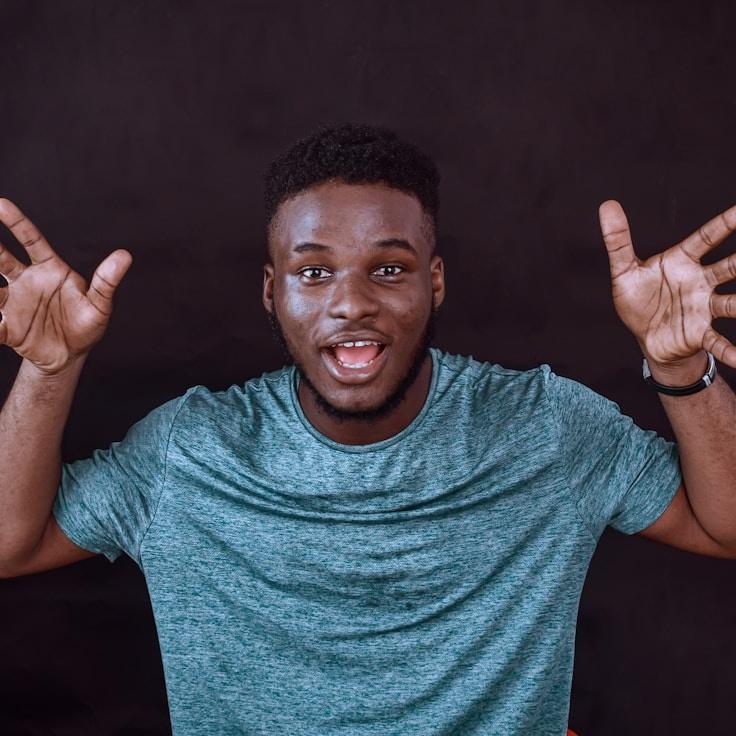 Avery Singh, Lead Design Curator at NodeAtelierGrain, reviewing corporate floral arrangements